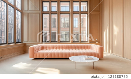 Modern minimalist living room with large windows and elegant peach sofa 125180786
