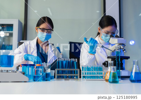 Glass vial, pipette and scientist in laboratory for medical study, research or experiment. Test tube, dropper and professional person with chemical liquid for pharmaceutical innovation. Glass vial, pipette and scientist in laboratory for medical study, research or experiment. Test tube, dropper and professional person with chemical liquid for pharmaceutical innovation. 125180995