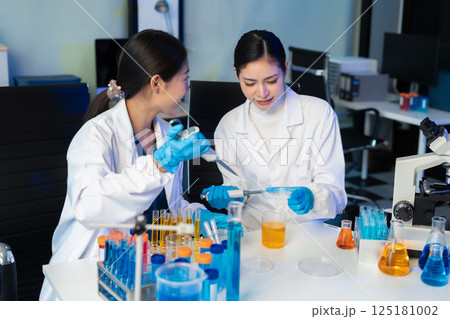 Glass vial, pipette and scientist in laboratory for medical study, research or experiment. Test tube, dropper and professional person with chemical liquid for pharmaceutical innovation. Glass vial, pipette and scientist in laboratory for medical study, research or experiment. Test tube, dropper and professional person with chemical liquid for pharmaceutical innovation. 125181002