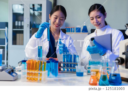 Glass vial, pipette and scientist in laboratory for medical study, research or experiment. Test tube, dropper and professional person with chemical liquid for pharmaceutical innovation. Glass vial, pipette and scientist in laboratory for medical study, research or experiment. Test tube, dropper and professional person with chemical liquid for pharmaceutical innovation. 125181003