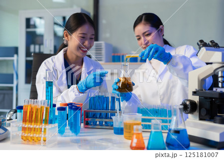 Glass vial, pipette and scientist in laboratory for medical study, research or experiment. Test tube, dropper and professional person with chemical liquid for pharmaceutical innovation. 125181007
