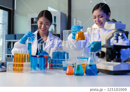 Glass vial, pipette and scientist in laboratory for medical study, research or experiment. Test tube, dropper and professional person with chemical liquid for pharmaceutical innovation. Glass vial, pipette and scientist in laboratory for medical study, research or experiment. Test tube, dropper and professional person with chemical liquid for pharmaceutical innovation. 125181009