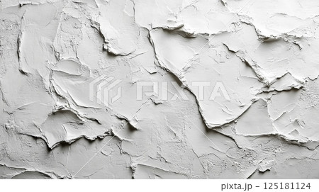 A textured wall displays a series of irregular patterns, highlighting an artistic approach to interior design with a clean white finish, ideal for contemporary spaces. 125181124