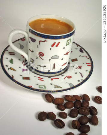 A cup of coffee on a table close view background A cup of coffee on a table close view background 125182926