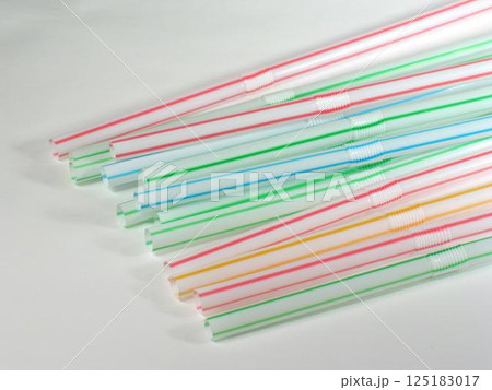 Colored straws over white background 125183017