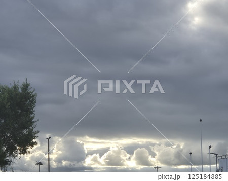 White cumulus clouds in the stormy sky 125184885