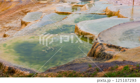 Brownish travertine formations at thermal springs in Karahyit, Turkey Brownish travertine formations at thermal springs in Karahyit, Turkey 125187293