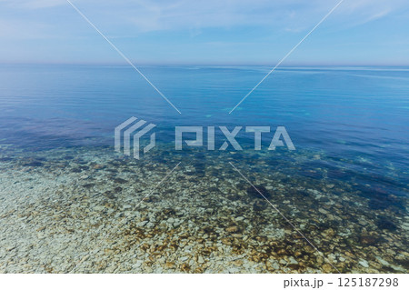 seascape with sandy beach and blue sky 125187298