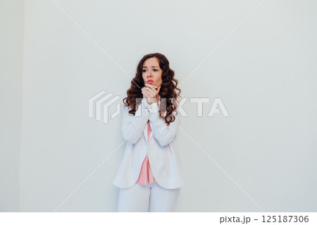 woman pondering on white office background woman pondering on white office background 125187306