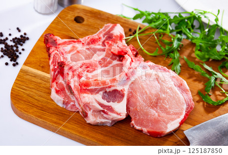 Fresh raw pork loin chops with condiments Fresh raw pork loin chops with condiments 125187850
