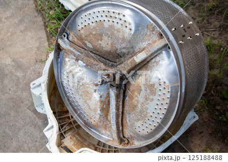 Breakage of the metal cross in the washing machine and non-separable drum. Fault in washing machines, close-up 125188488