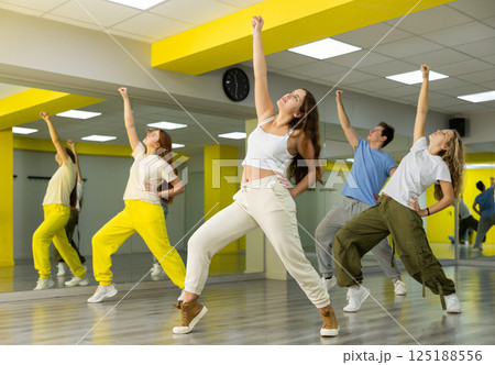 Young girl dancing modern dance in studio Young girl dancing modern dance in studio 125188556