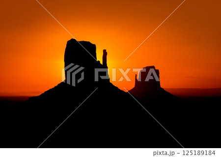 Sunrise at Monument Valley West and East Mittens Butte 125189184