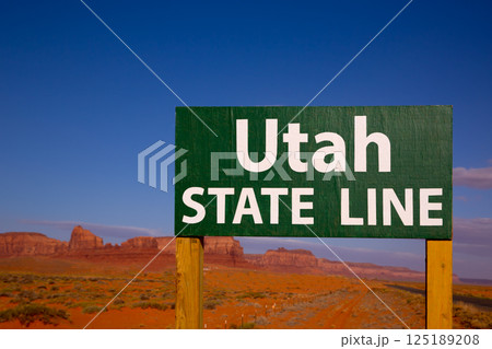 Road sign between Utah and Arizona State Line Road sign between Utah and Arizona State Line 125189208