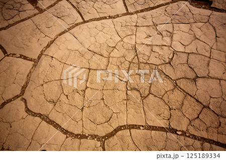 Mesquite Dunes dried clay macro detail in Death Valley Mesquite Dunes dried clay macro detail in Death Valley 125189334
