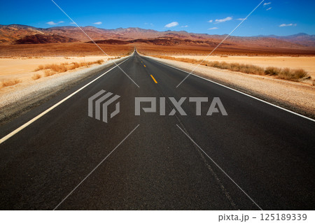 Death Valley straight road in desert National Park Death Valley straight road in desert National Park 125189339