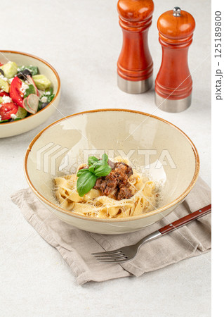 Portion of braised beef pasta pappardelle 125189800