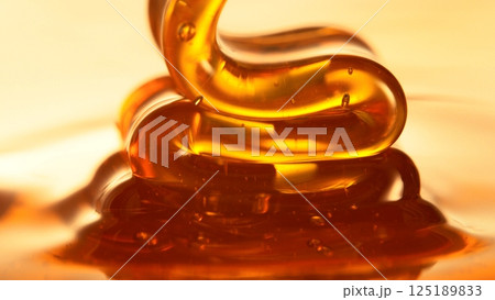 Closeup of Honey Pouring. 125189833