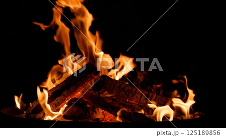 Camp Fire flames with sparks on a black background 125189856