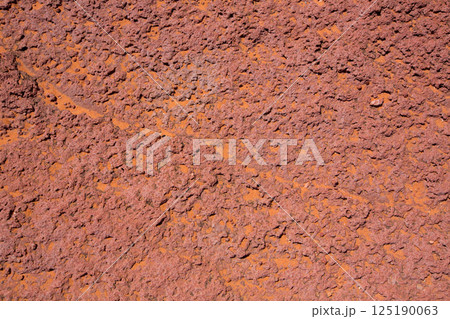Arizona red stone detail with orange desert sand 125190063