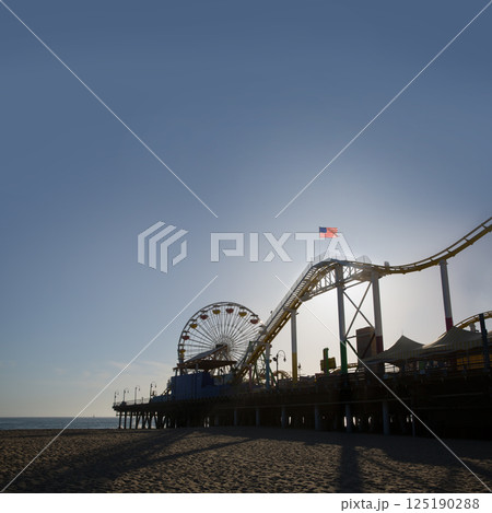 Santa Moica pier Ferris Wheel at sunset in California 125190288