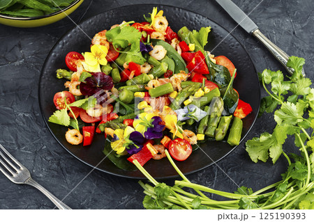 Delicious fresh salad with prawns and vegetables. Delicious fresh salad with prawns and vegetables. 125190393
