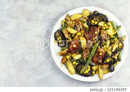 Cooked chicken legs. 125190397