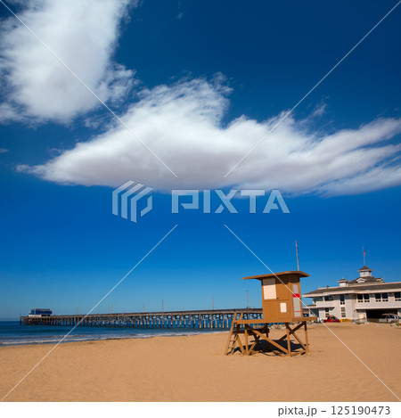 Newport pier beach with lifeguard tower in California 125190473