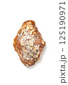 Homemade crunchy croissant with almond flakes and sugar powder isolated 125190971