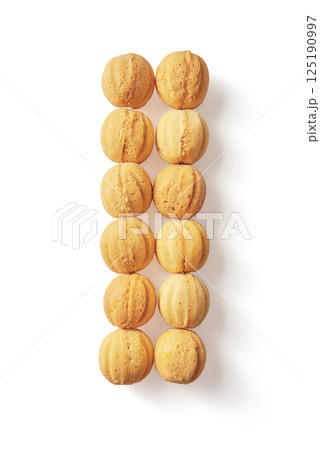 Top view of baked nuts with condensed milk inside isolated on white background 125190997