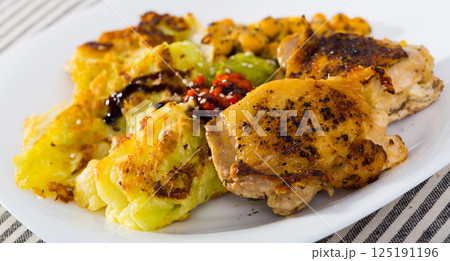 Chicken thighs with chickpeas and cabbage Chicken thighs with chickpeas and cabbage 125191196
