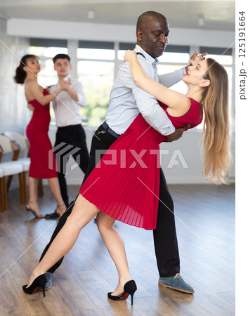 Adult man and young woman dancing tango 125191664
