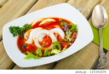 Tomato soup with squid and greens Tomato soup with squid and greens 125191670