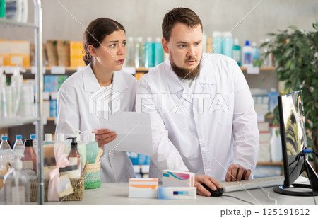 Director and pharmacist analyze documents, are horrified by results of work in current half-year 125191812