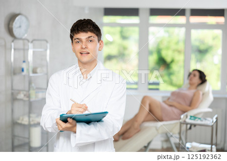 male doctor with folder male doctor with folder 125192362