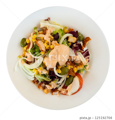 Caesar salad with chicken pieces, tomatoes on a white plate Caesar salad with chicken pieces, tomatoes on a white plate 125192708