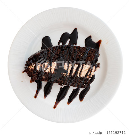 Piece of dark chocolate cake with topping 125192711