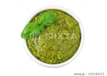 Pesto sauce in ceramic bowl isolated on white background. Top view. Flat lay. Pesto sauce in ceramic bowl isolated on white background. Top view. Flat lay. 125193171
