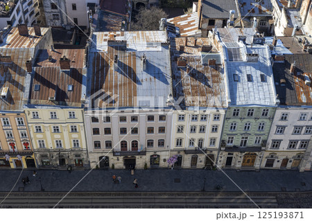 View from above of the main square of Lviv. People are walking around the town 125193871