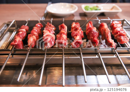 Chinese food. Grilled lamb skewers.	 Chinese food. Grilled lamb skewers.	 125194076