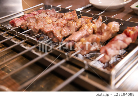 Chinese food. Grilled lamb skewers.	 125194099