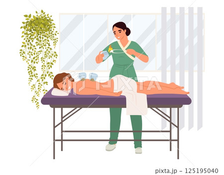 A skilled practitioner uses herbal remedies to treat a client receiving oriental medicine therapy on a massage table. The calming environment enhances relaxation A skilled practitioner uses herbal remedies to treat a client receiving oriental medicine therapy on a massage table. The calming environment enhances relaxation 125195040