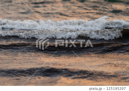 Gentle Waves on Calm Sea at Dusk Gentle Waves on Calm Sea at Dusk 125195207