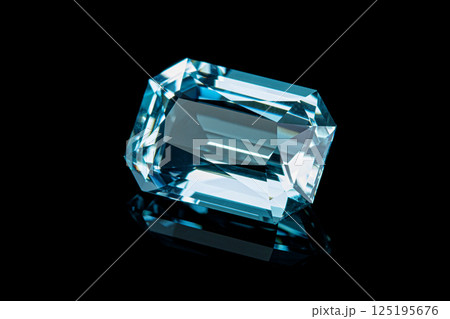 faceted aquamarine stone on a black background faceted aquamarine stone on a black background 125195676