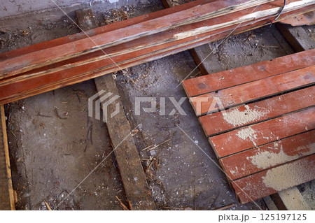 The house is undergoing renovation work to replace the old wooden floors 125197125