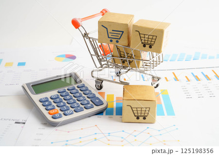 Online shopping, Shopping cart box on business graph, import export, finance commerce. 125198356