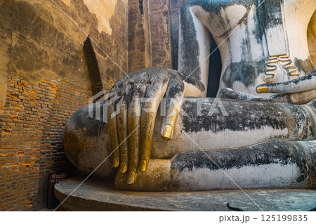 Giant Statue Of A Seated Buddha With Tapered Fingers Covered With Gold 125199835