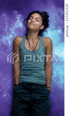 woman in green tank top smiles peacefully against cosmic background 125201326