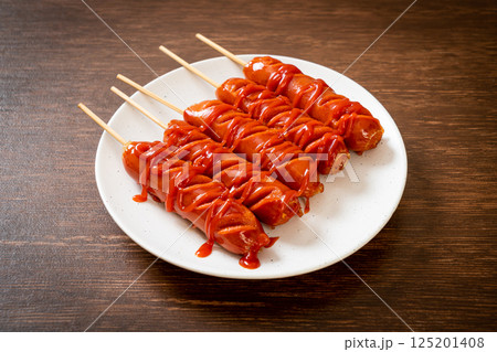 fried sausage skewer with ketchup fried sausage skewer with ketchup 125201408