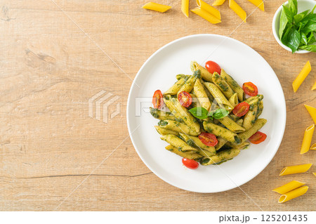 penne pasta with pesto sauce and tomatoes 125201435